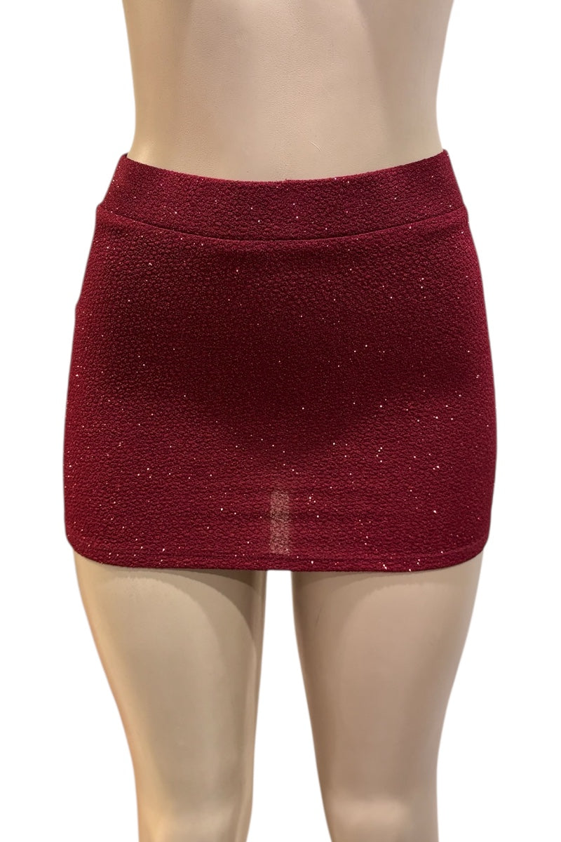 burgundy glittery skirt on a mannequin against a white background