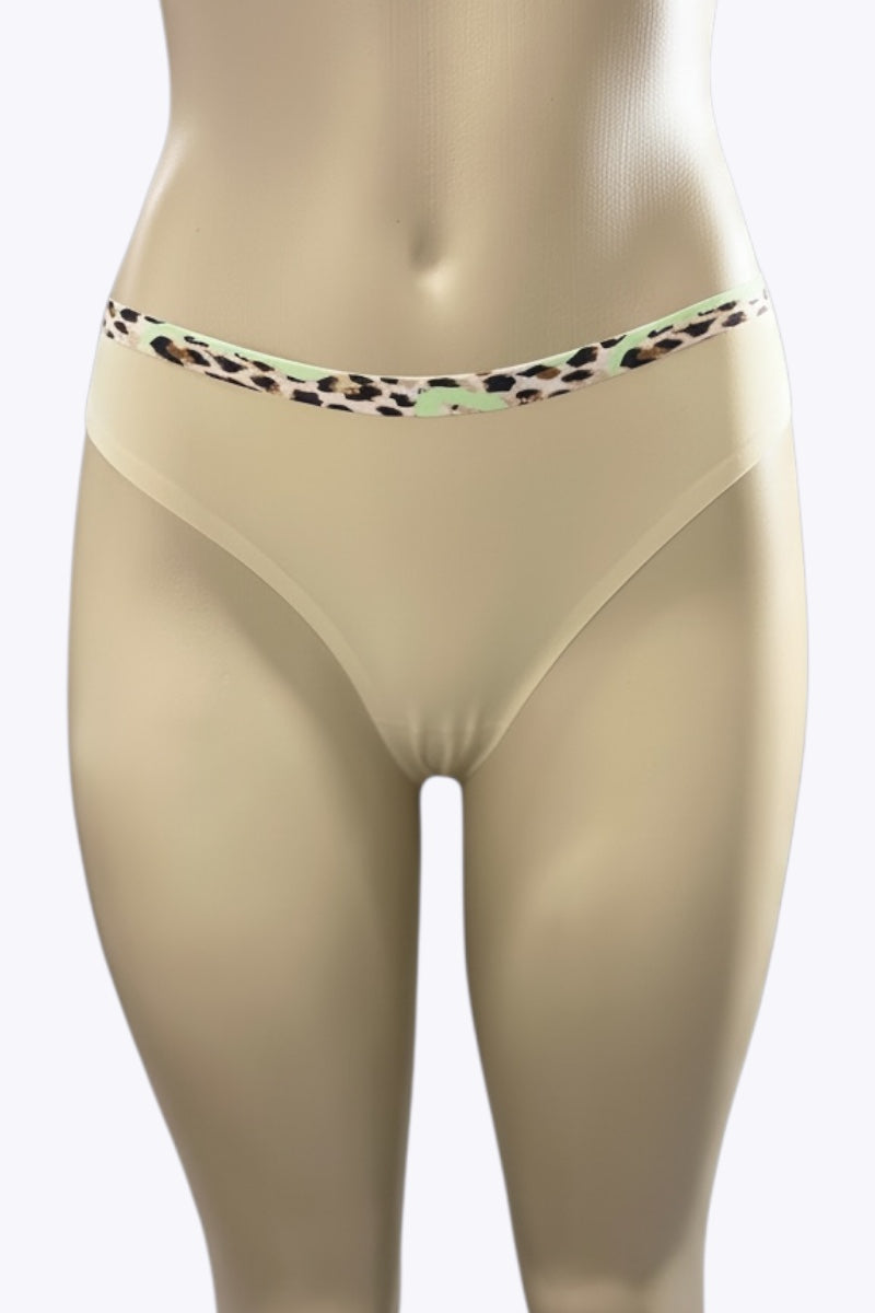 Beige underwear with a leopard print waistband on a mannequin against a white background