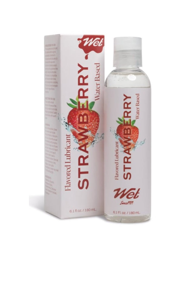 A bottle of Wet Strawberry flavored water-based flavored lubricant next to its white packaging box, both featuring a red strawberry graphic and red branding on a white background.