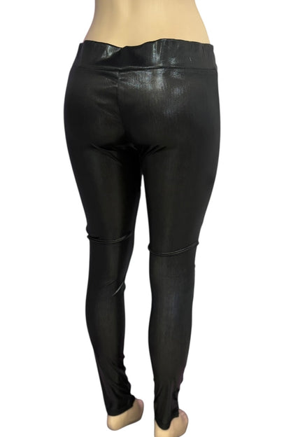 Black leather leggings worn by a person on a white background