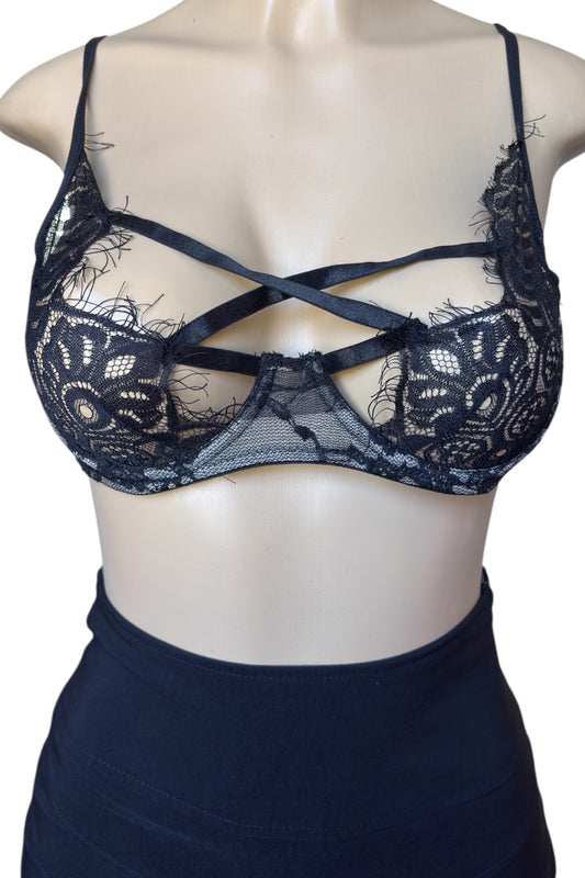 black lace bra on a mannequin with a plain background