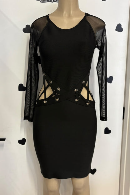 Black dress with sheer sleeves on a mannequin against a white background