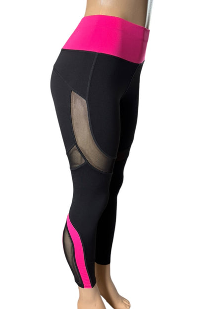 Black leggings with pink accents on a mannequin against a white background