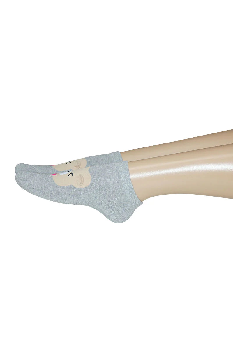 Gray socks on a mannequin foot against a white background