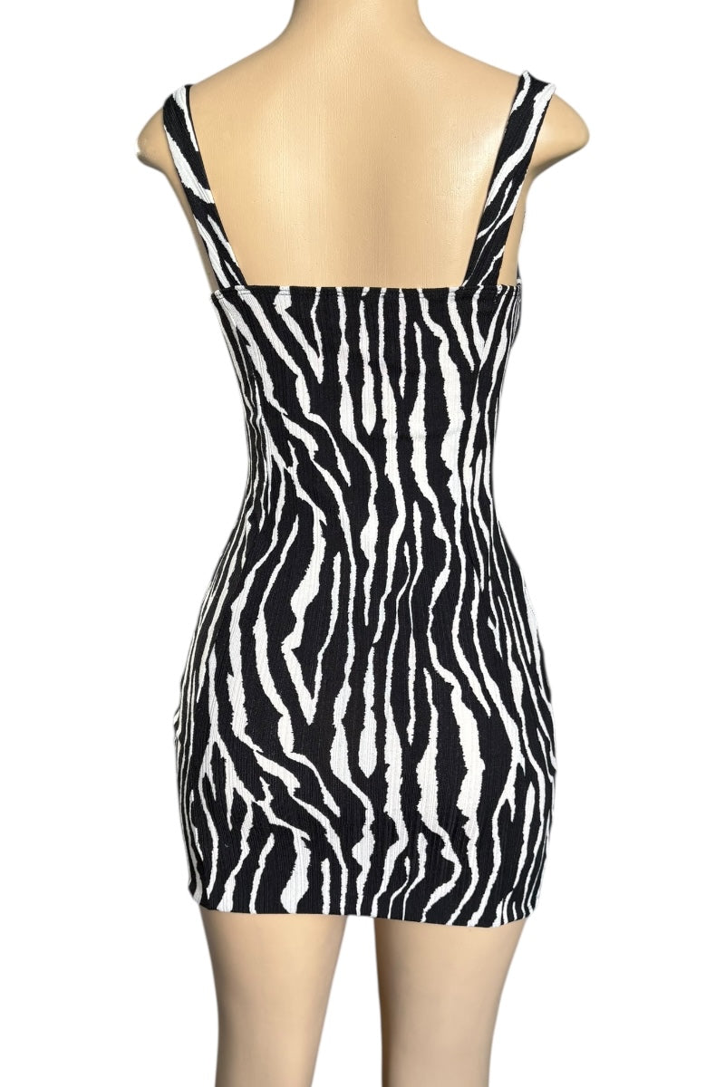 Zebra print dress on a mannequin against a white background