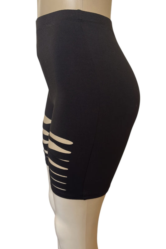 Black shorts with cut-out design on a mannequin against a white background