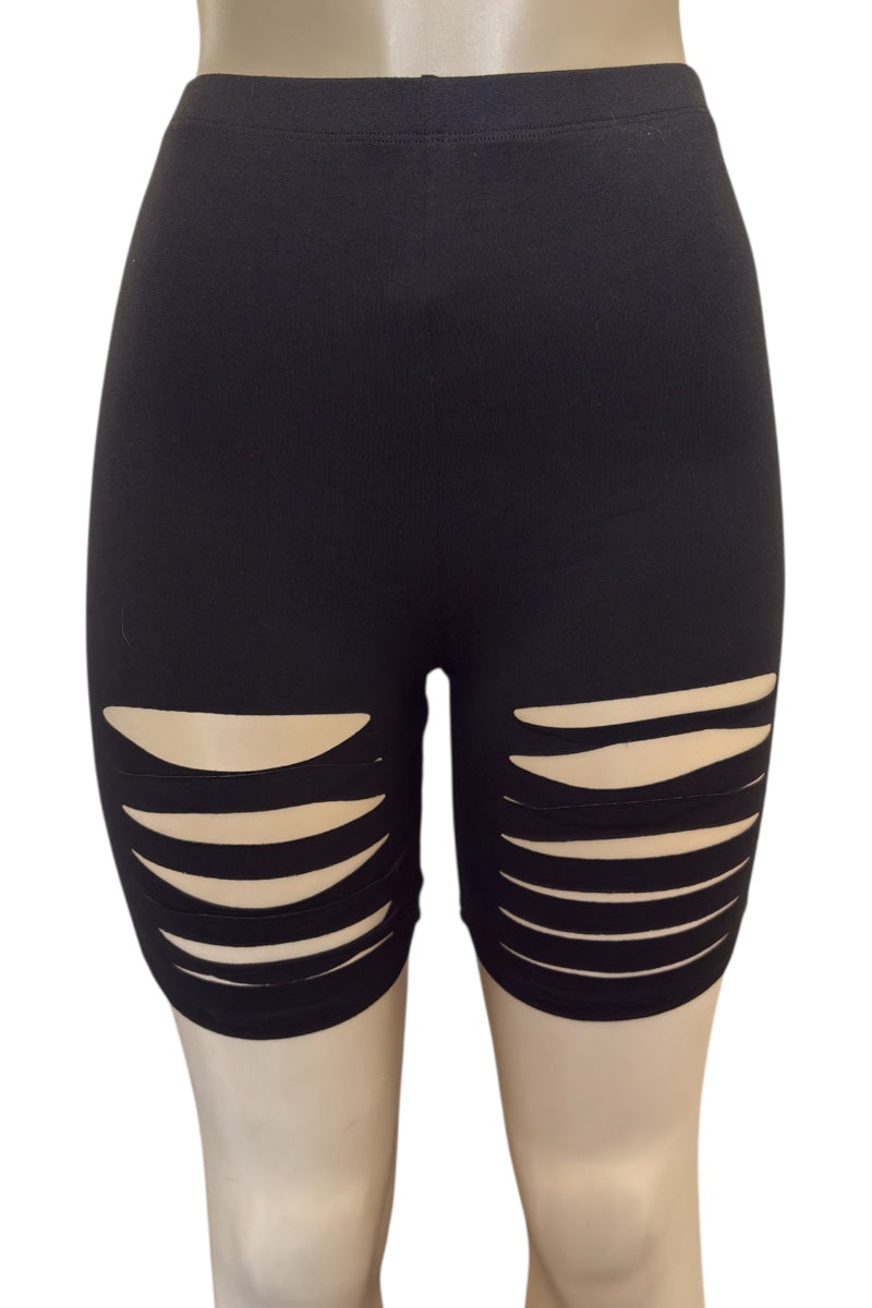 Black shorts with cut-out design on a mannequin against a white background