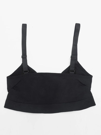 Black bralette with thin straps on a white background