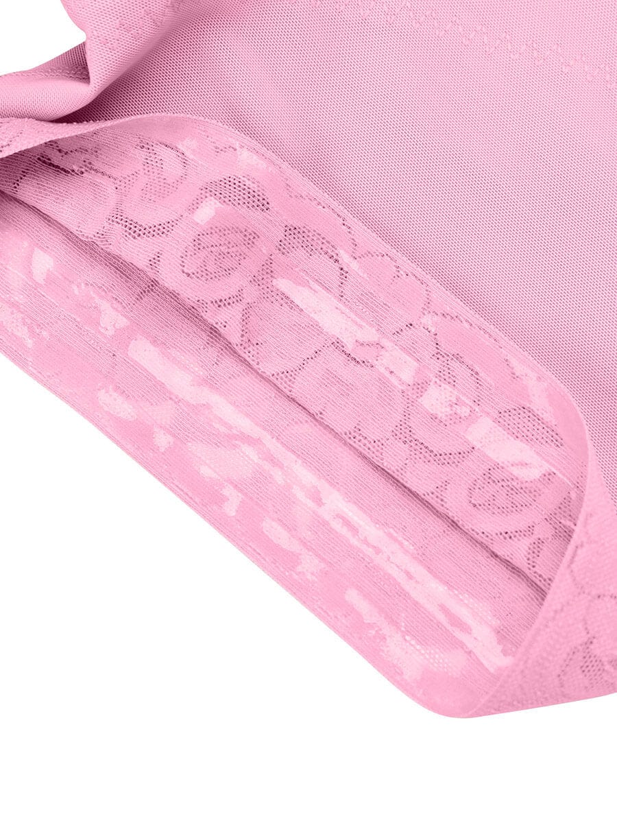 Close-up of a pink fabric with lace detailing on a white background