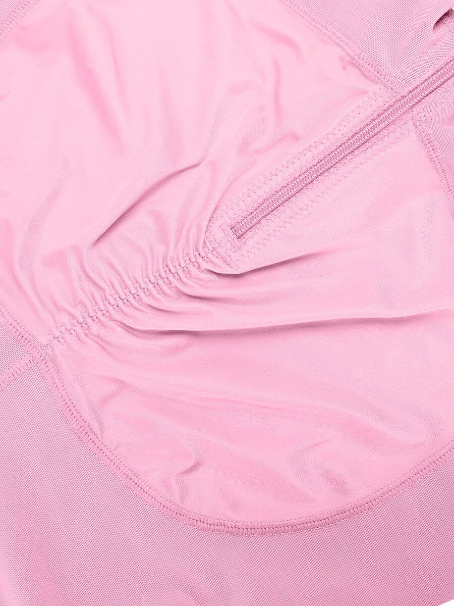 Close-up of a pink shaper with a zipper detail