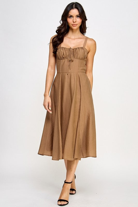 Woman wearing a brown dress on a white background