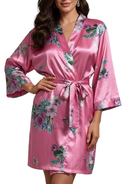 Hot Pink satin robe with floral patterns worn by a model on a white background