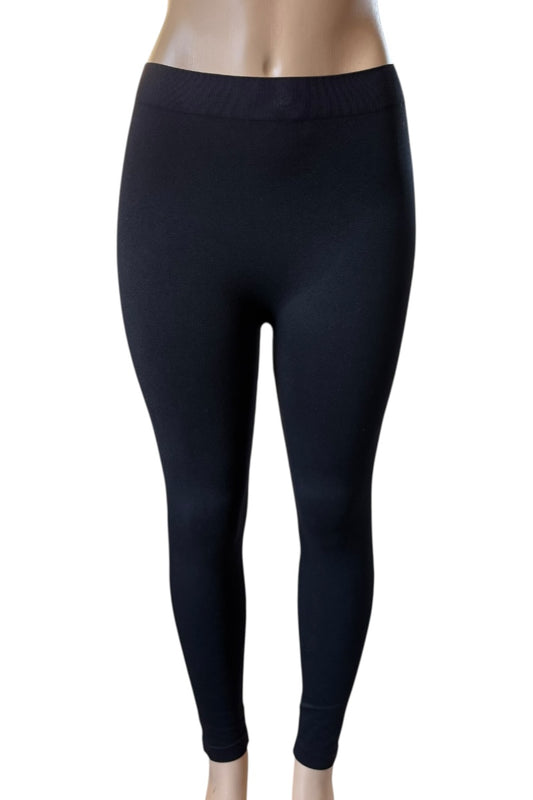 Black leggings on a mannequin against a white background