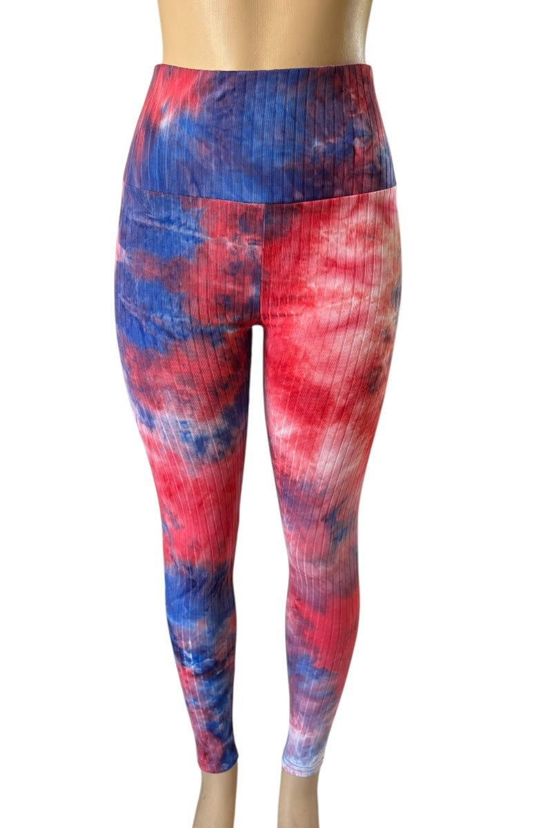 Red and blue tie-dye leggings on a white background