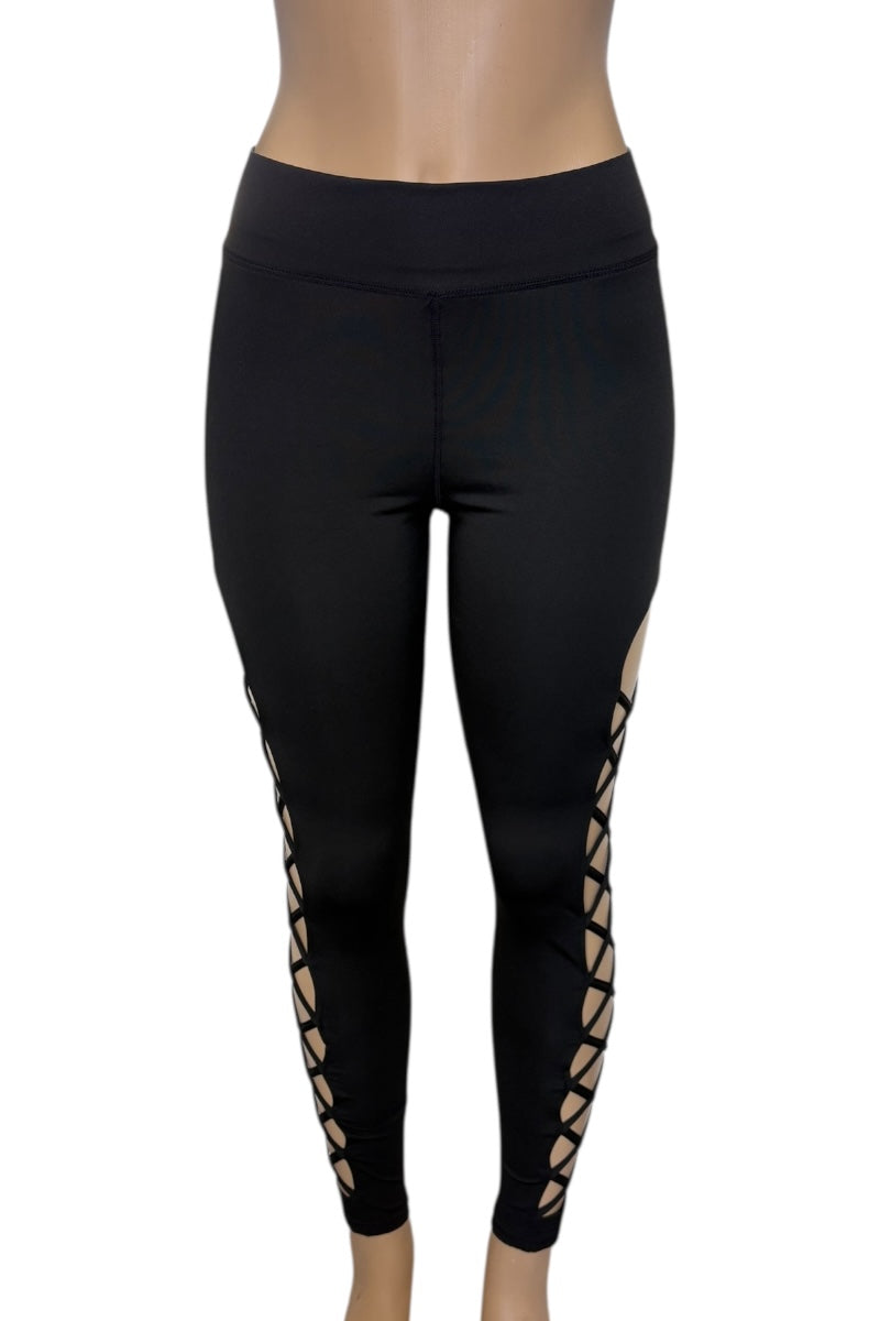 Black leggings with cut-out side panels on a white background