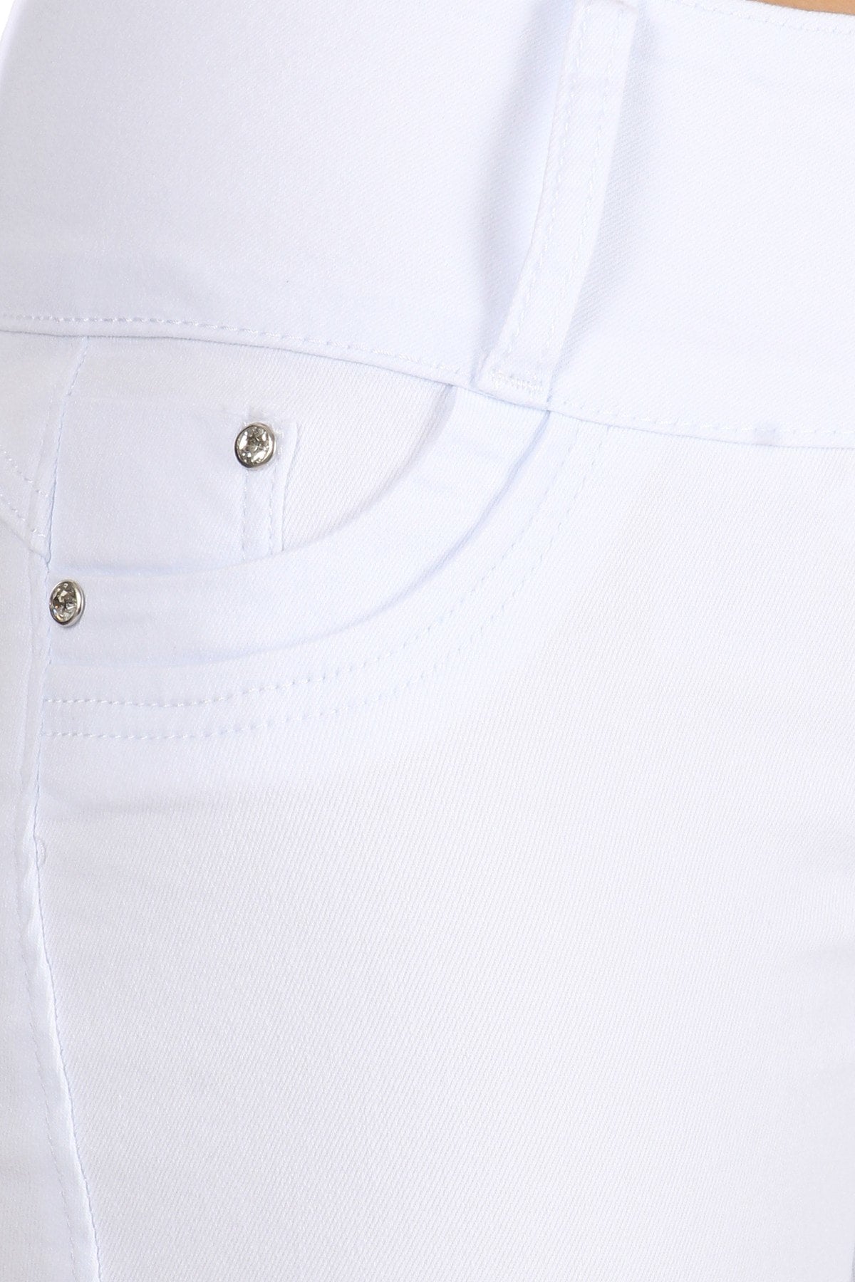 Close-up of white pants with a button detail on a white background
