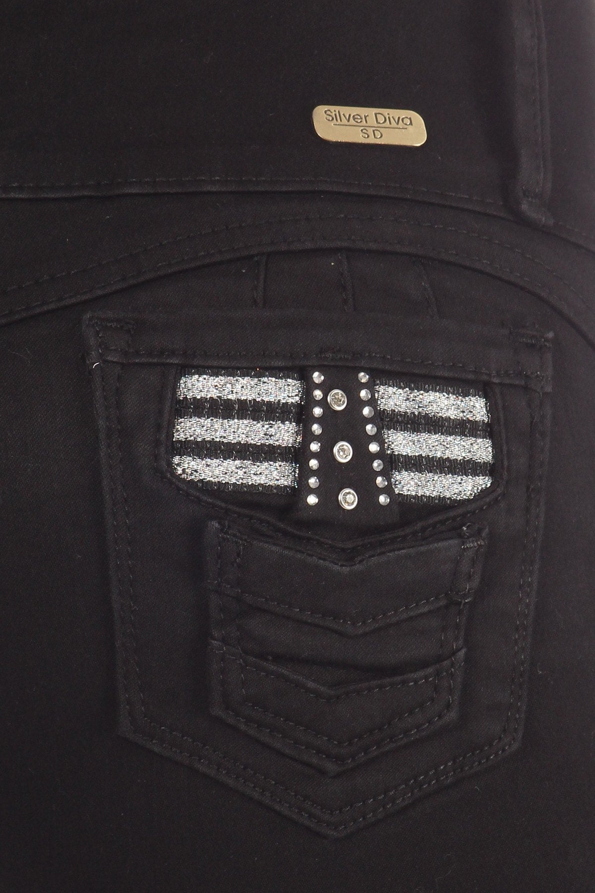 Close up of Black jeans with a decorative pocket and 'Silver Diva' label.
