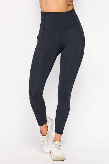 Black leggings worn by a person on a white background