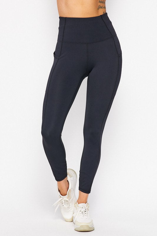 Black leggings worn by a person on a white background