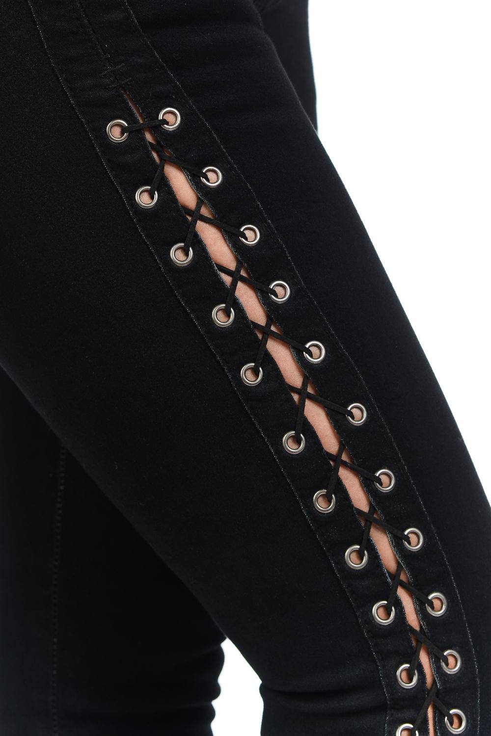 Black pants with lace-up detailing on a white background