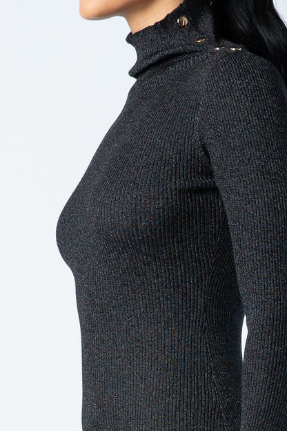 Black ribbed knit sweater worn by a person on a light gray background