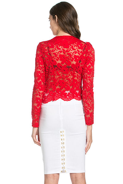 Red lace top worn by a model on a white background