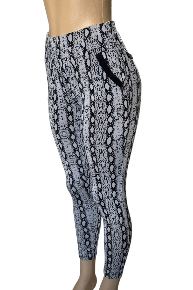 Snakeskin patterned leggings on a mannequin with a white background