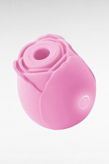 A pink, rose-shaped rechargeable vibrator with a smooth surface and a button on the base.