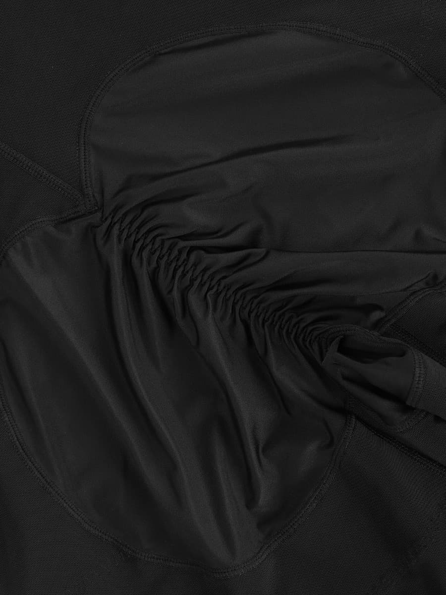 Close-up of a black shaper with a focus on texture and stitching.
