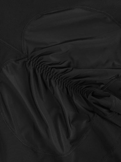 Close-up of a black shaper with a focus on texture and stitching.