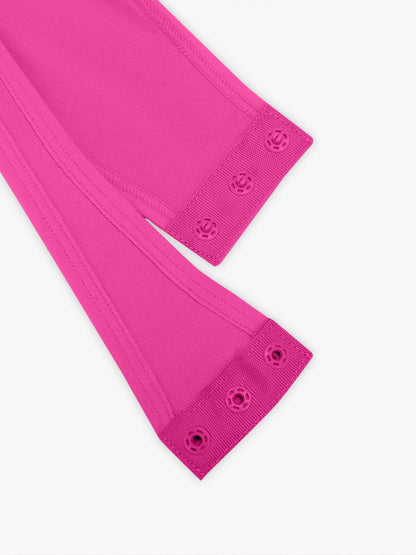 Close-up of bright pink top with buttons on a white background