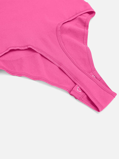 Close-up of a pink bodysuit on a white background