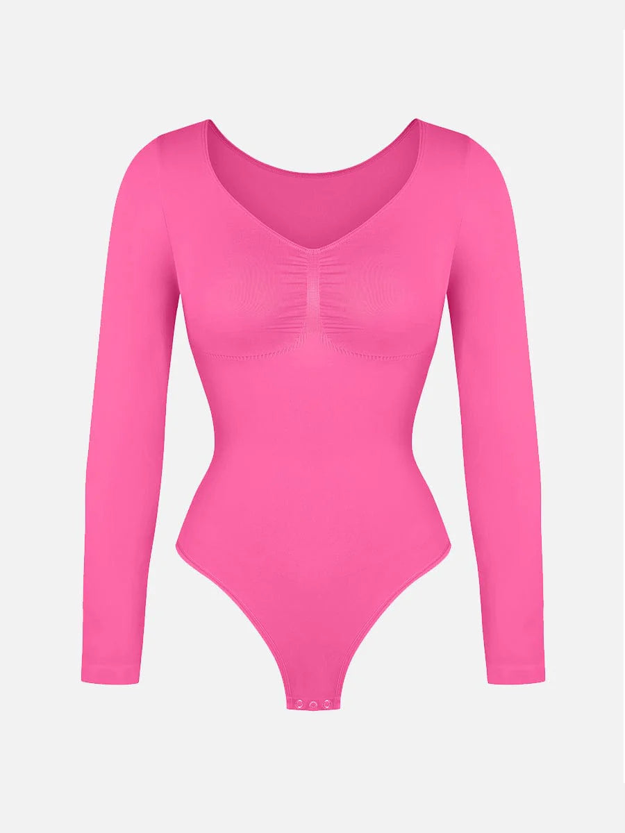 Pink bodysuit with long sleeves on a light gray background