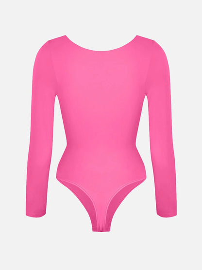 Pink bodysuit with long sleeves on a light gray background