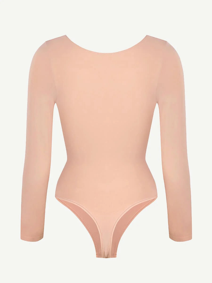 Nude-colored bodysuit with long sleeves on a light gray background
