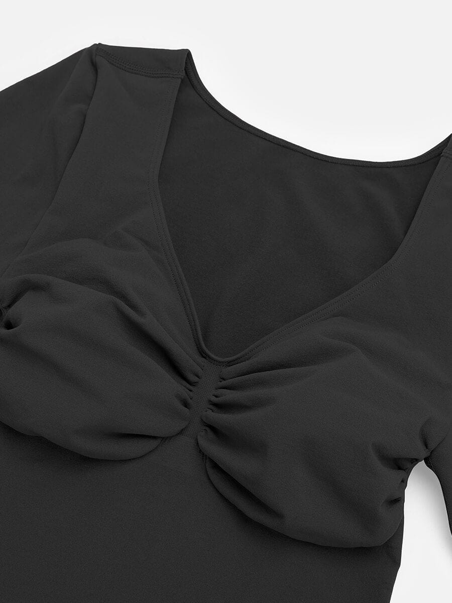 Black top with a scrunched detail on a white background