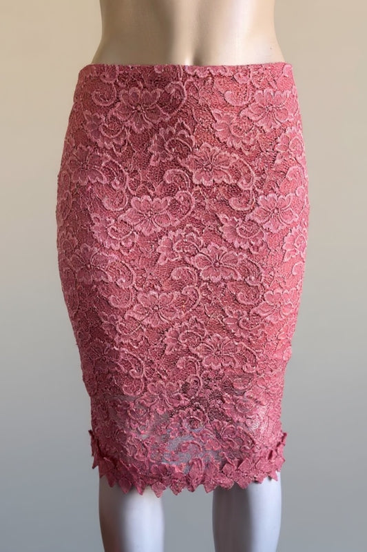 Pink lace pencil skirt on a mannequin against a plain background