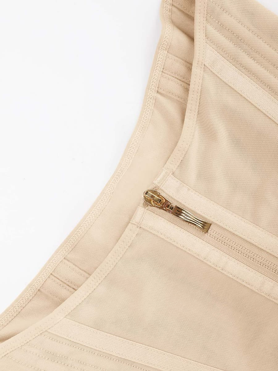Close-up of beige waist trainer with a zipper detail on a white background