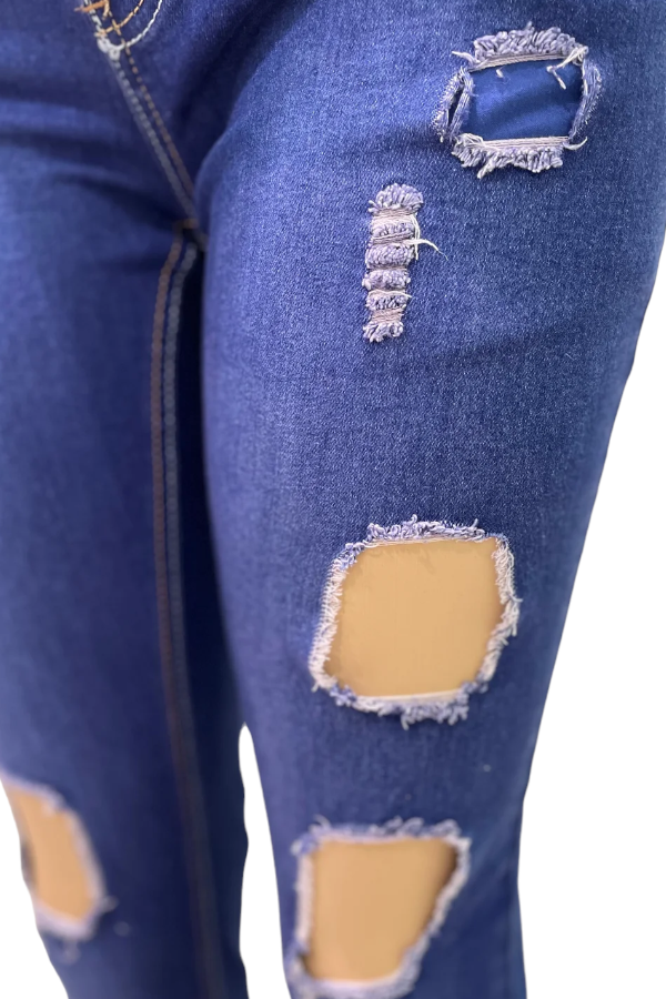 Close up of Patched Up Ripped Jeans in blue