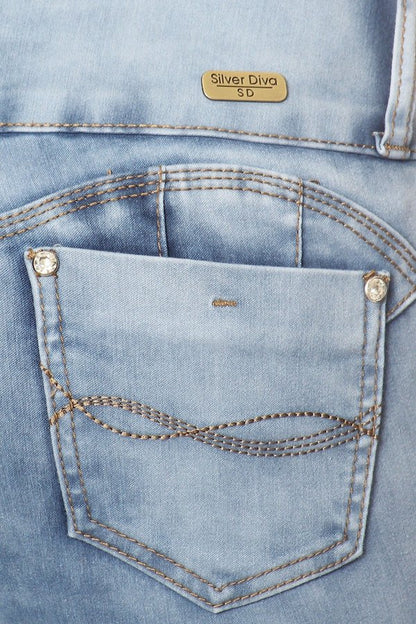 Close up of Ripped Skinny Jeans W/ Side Leg Cut Out