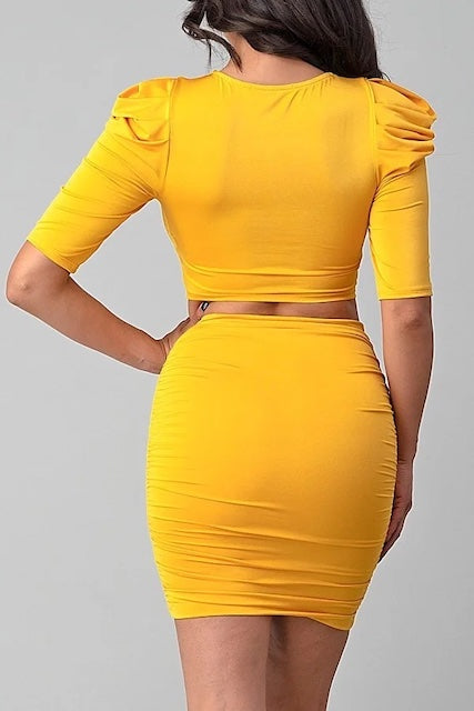 backside of Puffy Sleeves, Diamond Buckle Crop Top W/ Matching Skirt shown in mustard color
