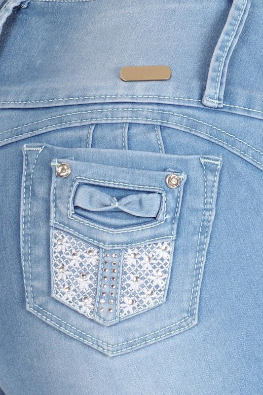 Close up of Celeste Distressed High Rise Jeans With Detailed Pockets in Light Blue