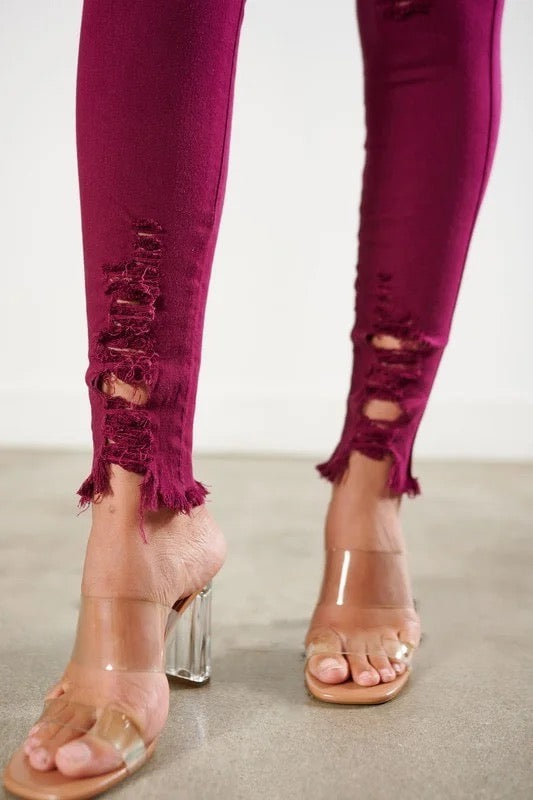 Close up of Classic Distressed Legs Jeans in Burgundy Color