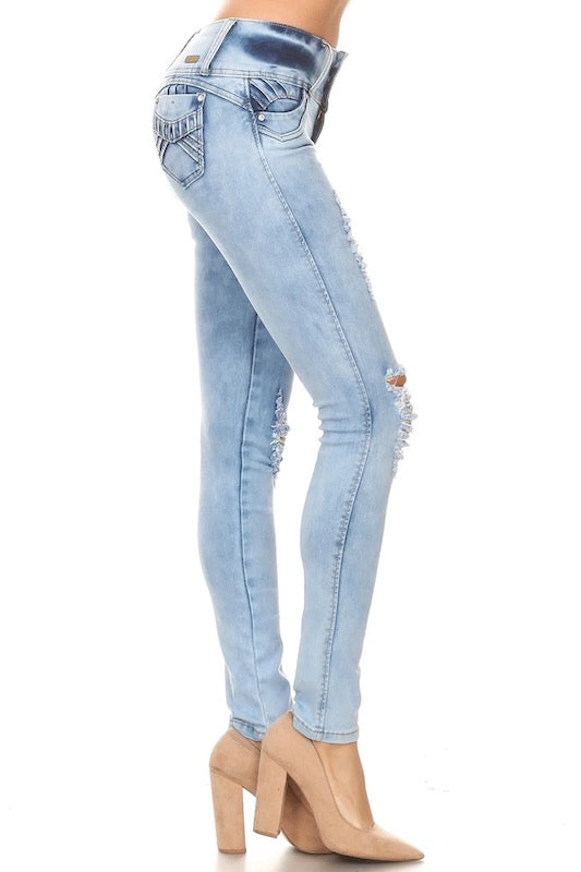 Side of Ripped, Acid Washed, Low Rise, Skinny Jeans in Light Blue Color