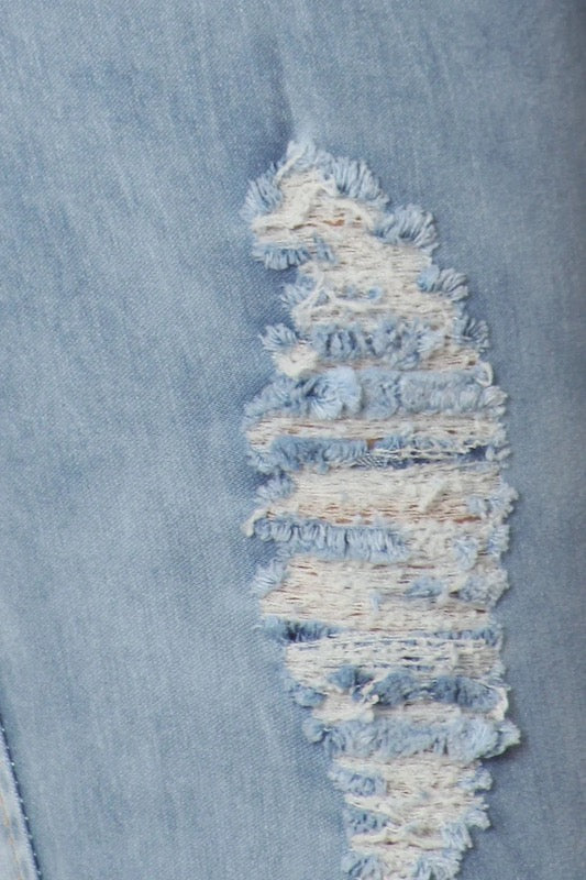Close up of Ripped, Acid Washed, Low Rise, Skinny Jeans in Light Blue Color